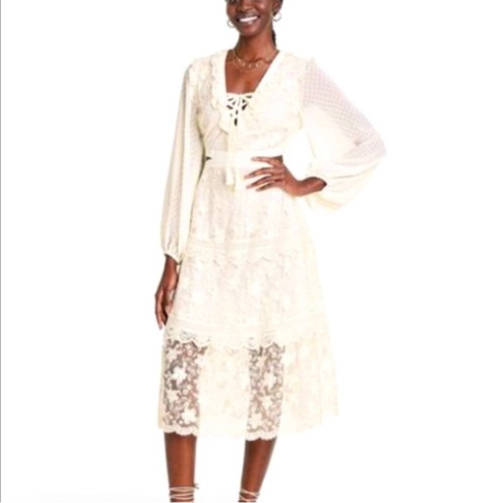 Beautiful cut out dress by ALEXIS.Size S. NWT.